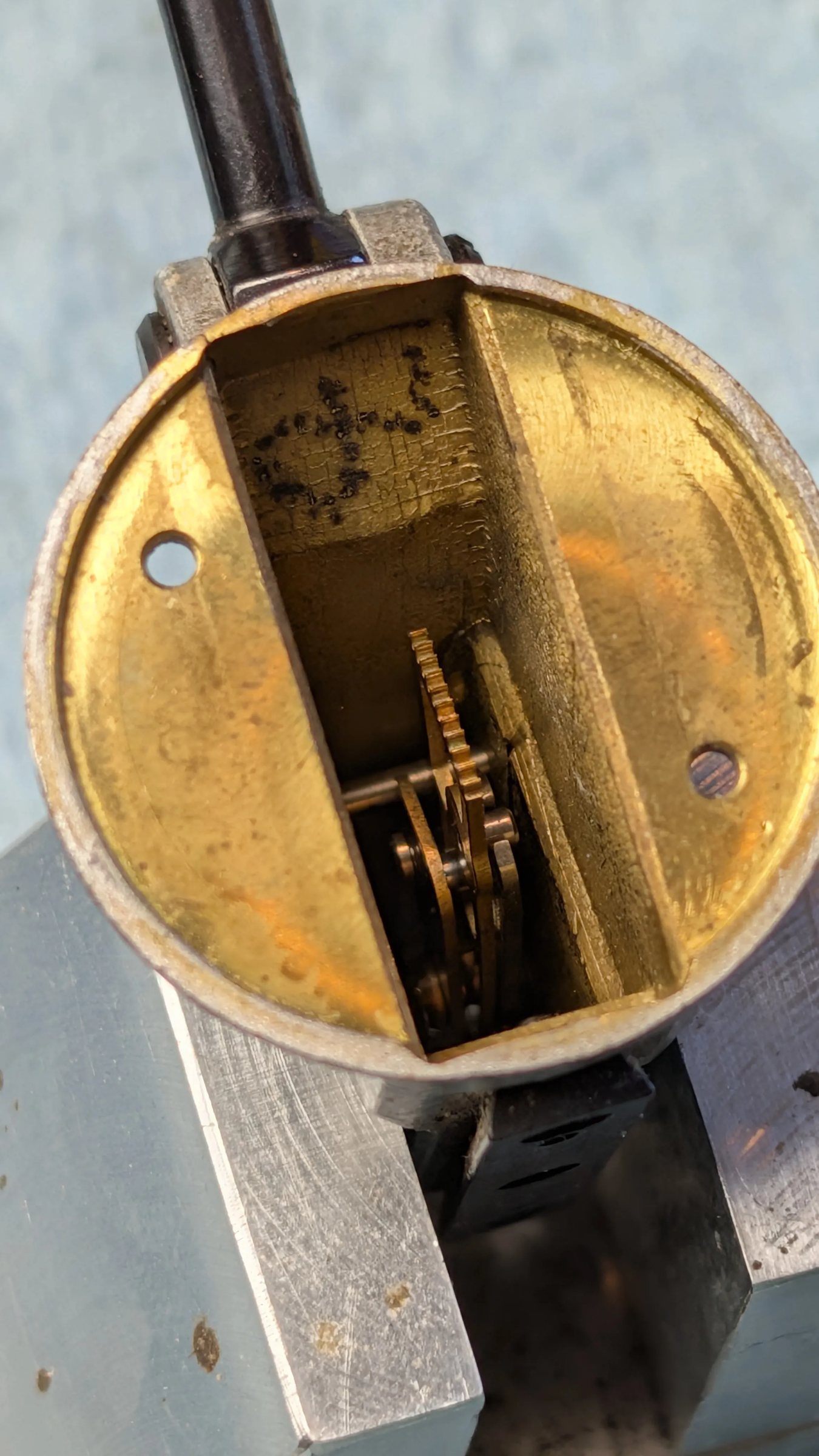 Oblique view into the body channel showing gear train in shadow